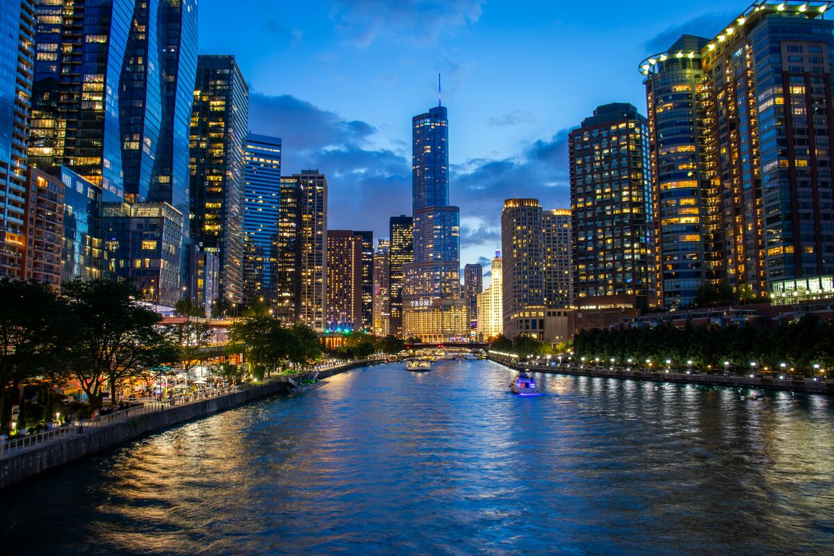 The Chicago River at night with the downtown skyline reflected in the water