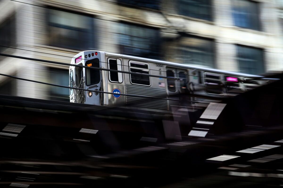 The 'L' elevated train passing overhead in Chicago, a common landmark near city dispensaries